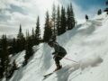 man in black jacket and blue pants riding ski blades on snow covered mountain during daytime